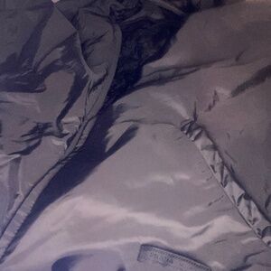 Prada jacket/ thin cool wind breaker all black with small patch on outsidepockeT